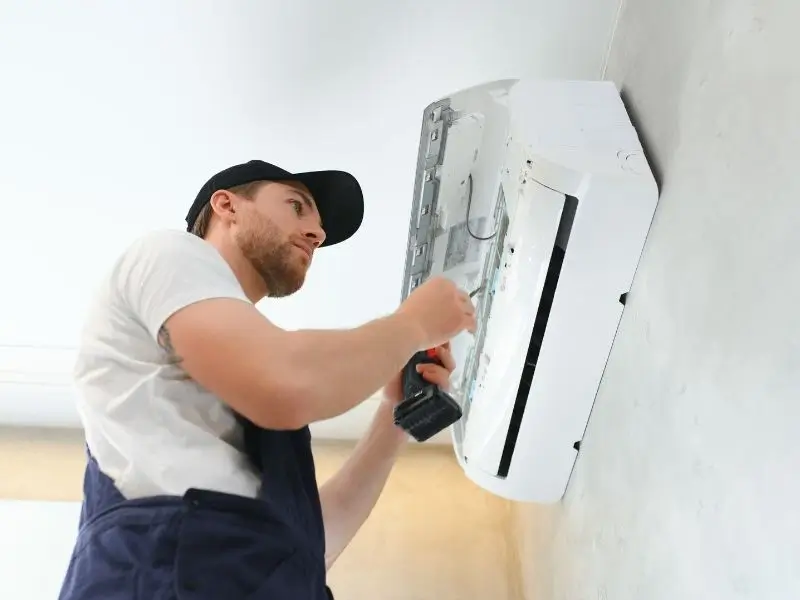 AC repair near me – professional technician fixing air conditioner